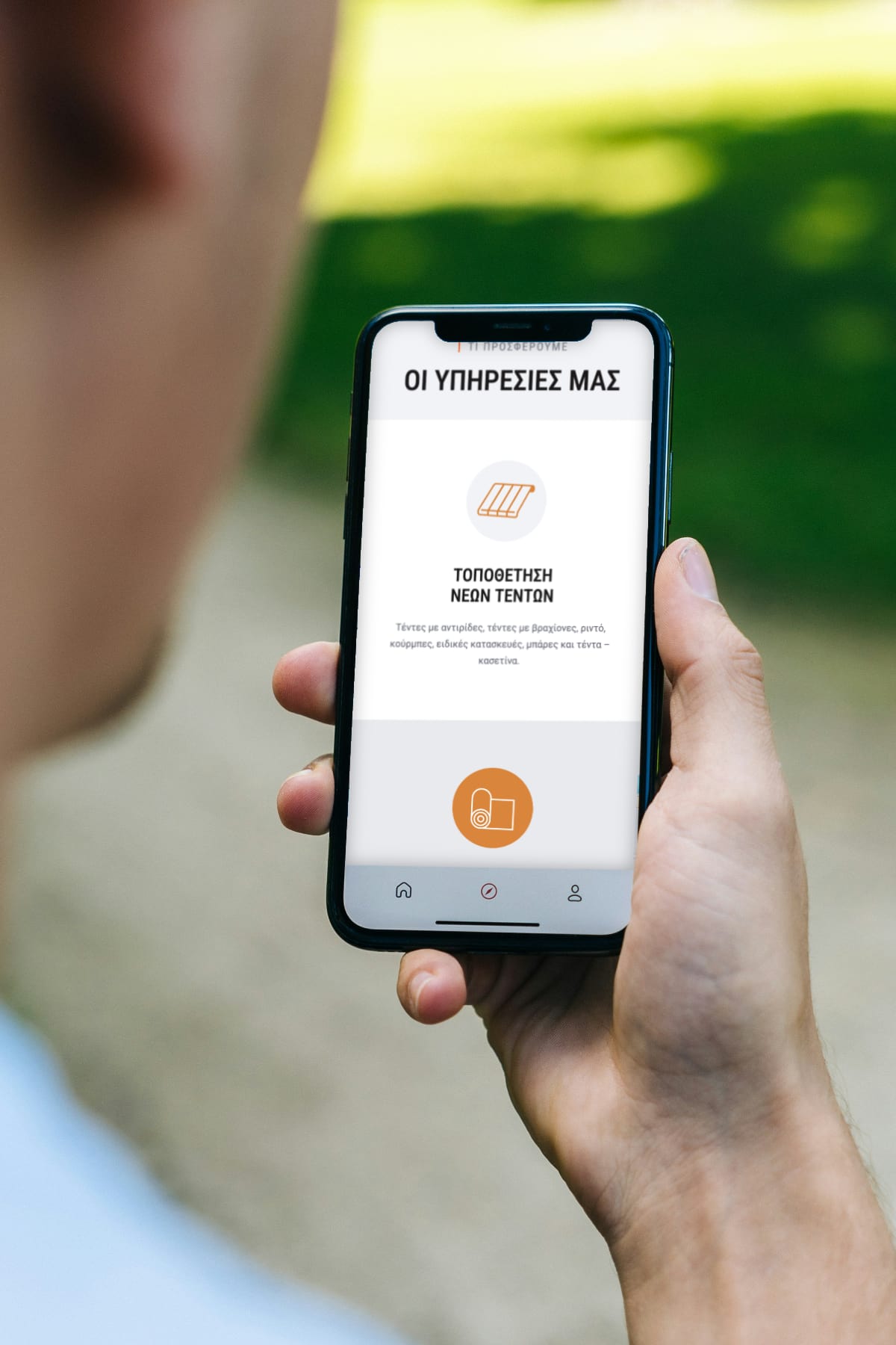 Tentes Pavlopoulos website homepage displayed on an iPhone screen, by Ichigo Web Studio — designed by Ichigo Web Studio.